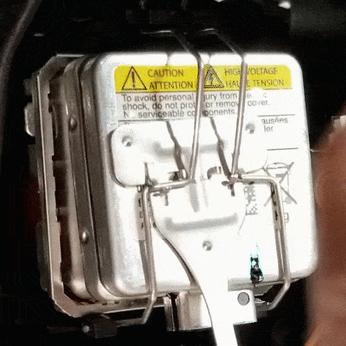 bmw e90 xenon headlight bulb replacement - release the xenon bulb metal locking clip
