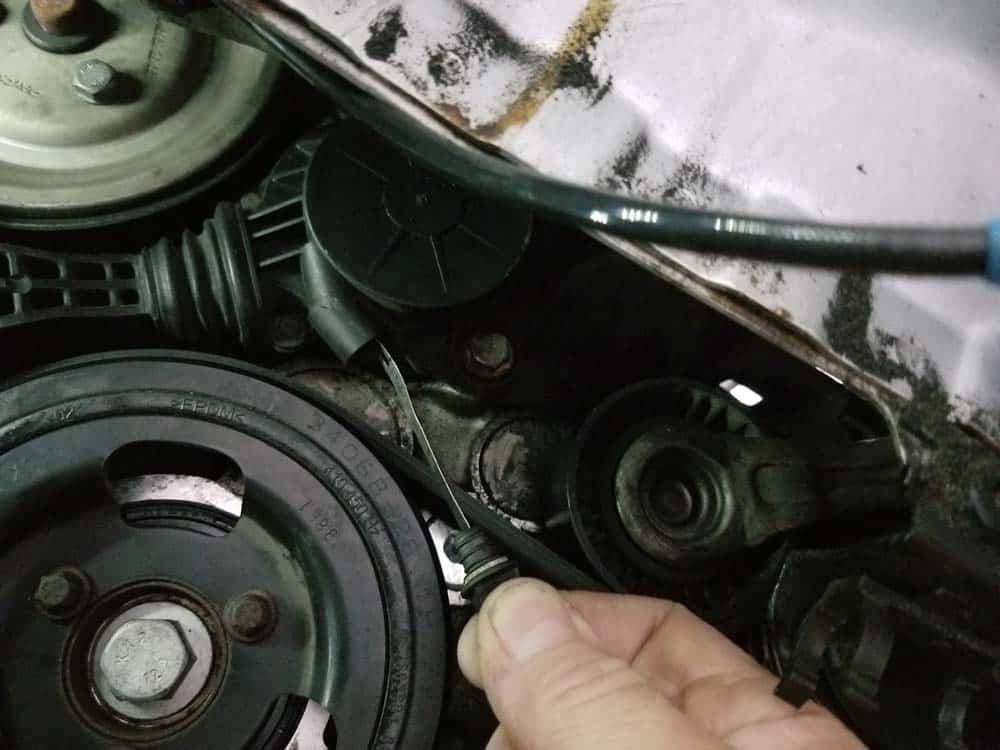 mini r56 water pump replacement - Retract the friction wheel until it disengages from the water pump
