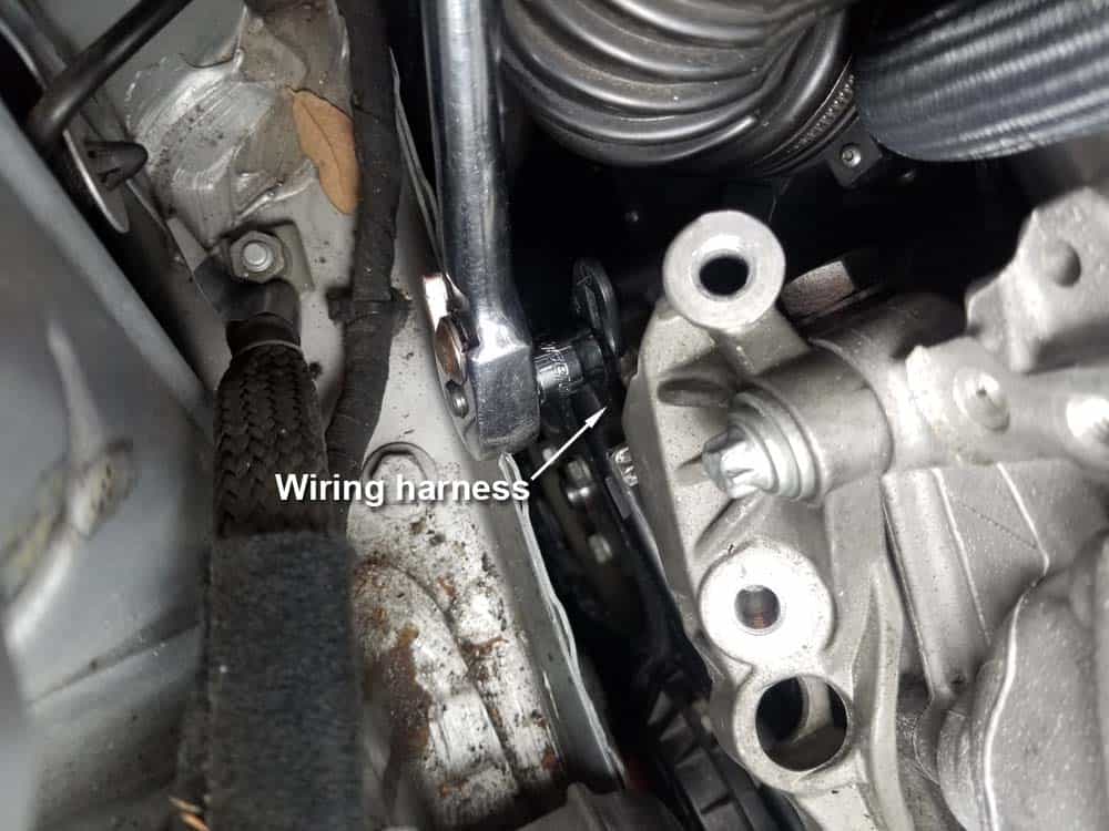 mini r56 water pump replacement - Remove the rear 10mm wiring harness bolt