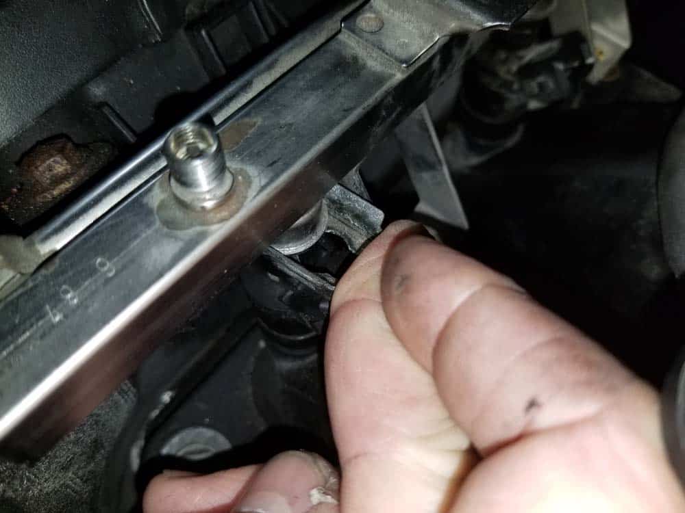 Reinstall the metal fuel injector holder clips
