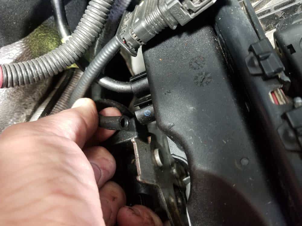 Unplug the two vacuum lines on side of valve cover