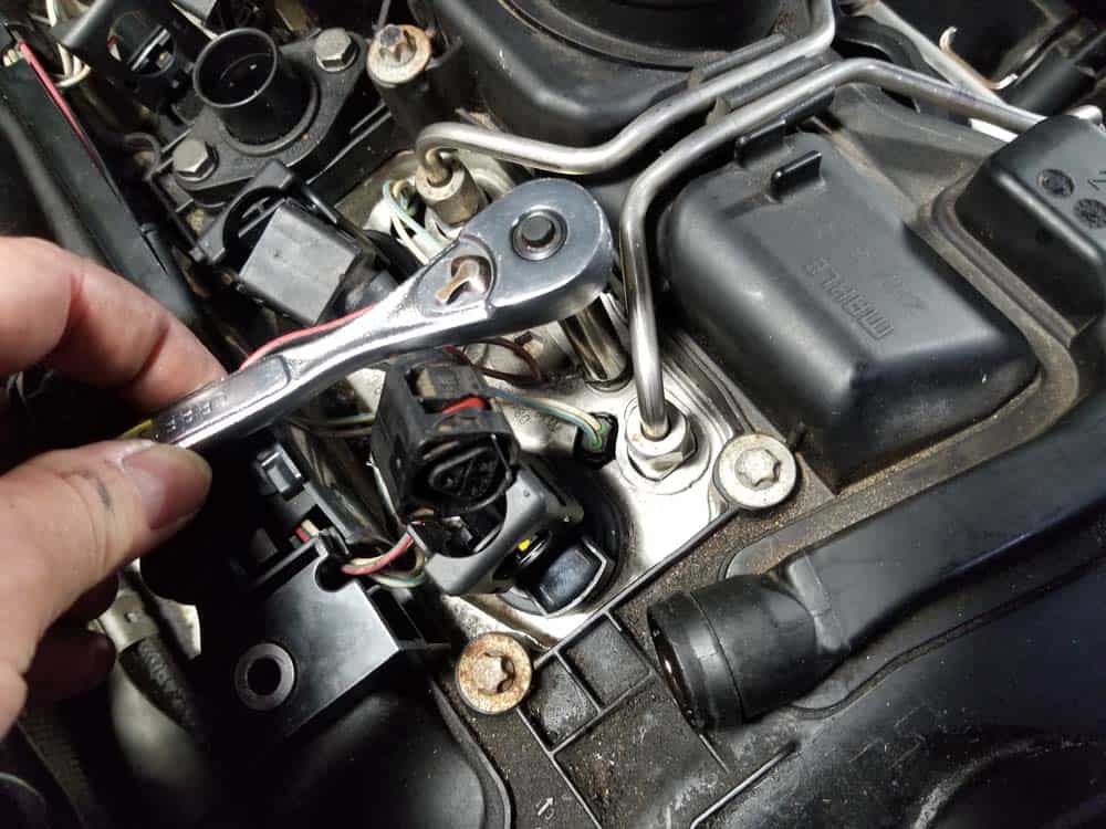 bmw n55 valve cover gasket replacement - Remove the 10mm nut securing the grounding wire to the cylinder head