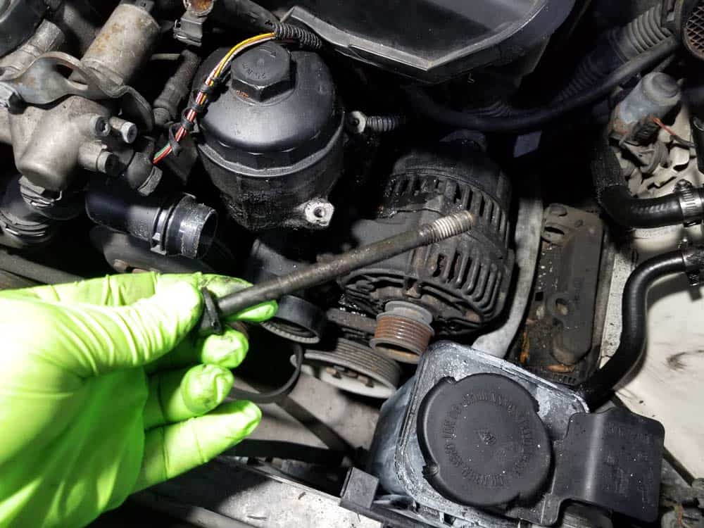 bmw e46 alternator replacement - Remove the lower mounting bolt from the alternator