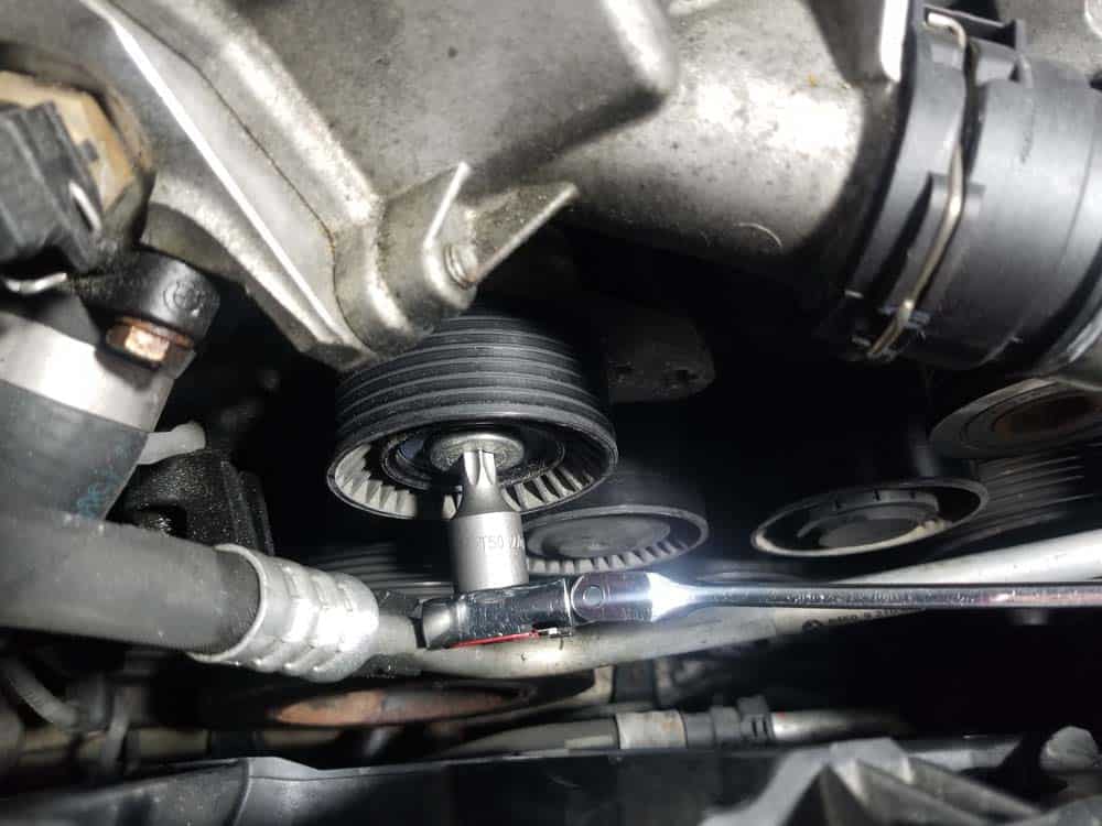 bmw n55 engine squeal - Use a T50 torx bit to remove the belt tensioner mounting bolt