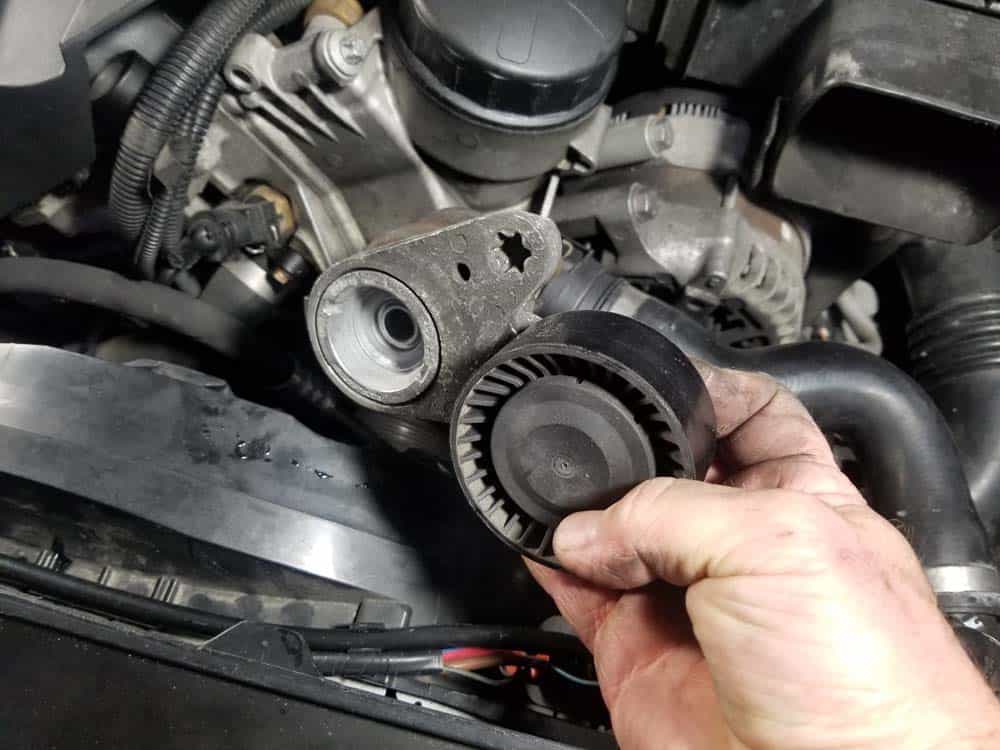 bmw n55 engine squeal - Remove the belt tensioner from the vehicle