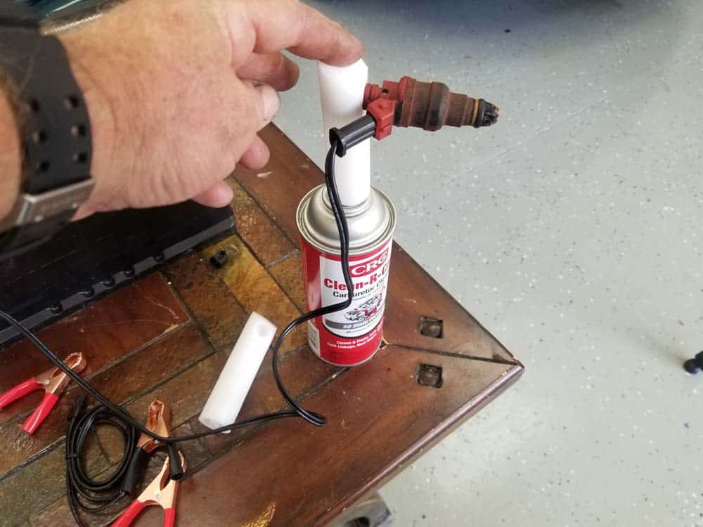 fuel injector cleaning kit - Use one hand to push the nozzle 