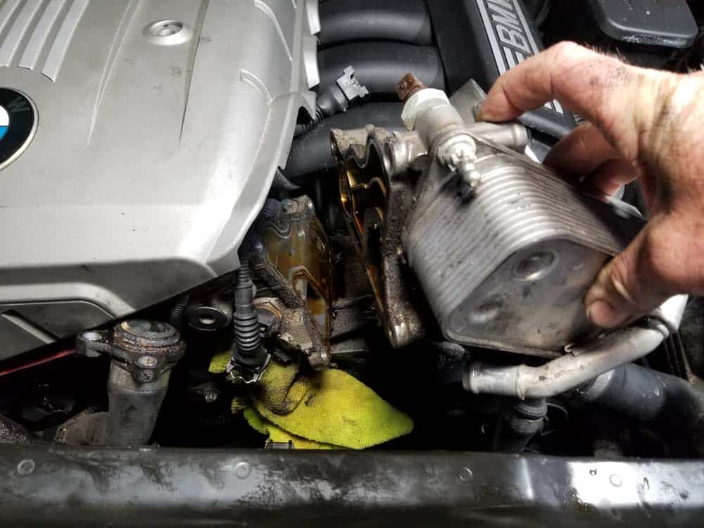 bmw n52 oil filter housing gasket replacement - Grasp the oil filter housing and pull it loose from the cylinder head.