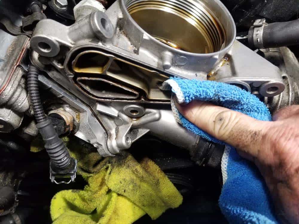 Clean the oil cooler and housing surfaces