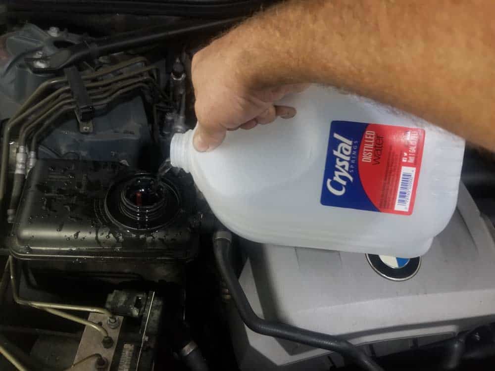 bmw e60 coolant flush - Add distilled water to the expansion tank