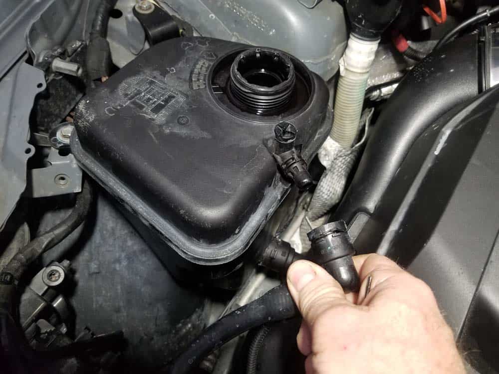 Pull the vent line free from the expansion tank