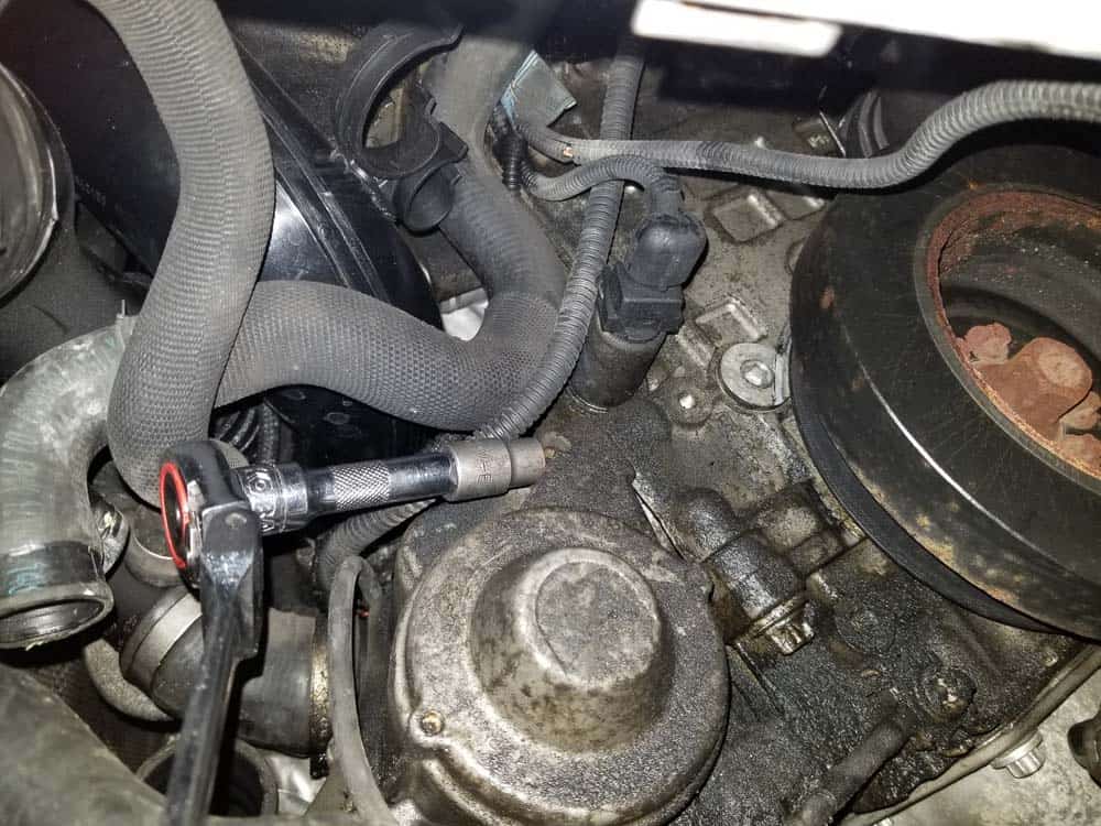 Remove the top mounting bolt.