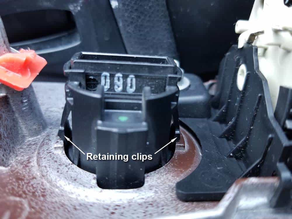 bmw e90 start button replacement - Locate the metal retaining clips on the sides of the start/stop switch
