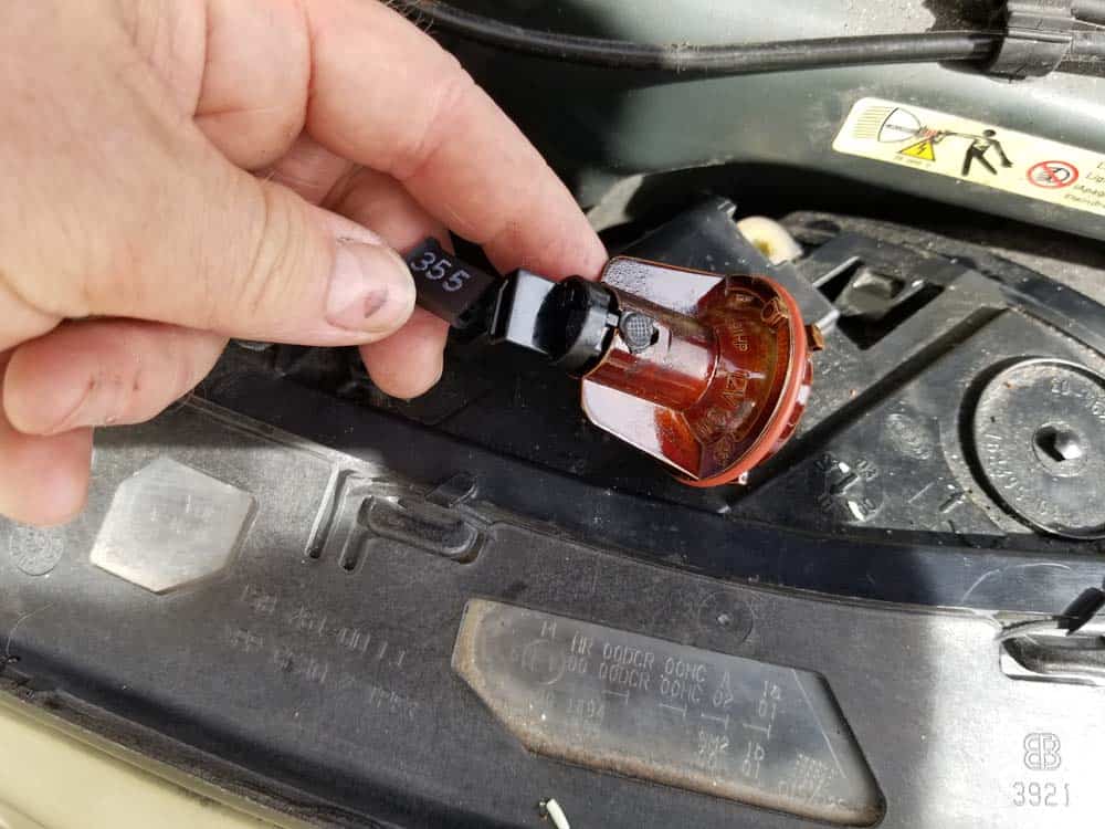 Unplug the back of the parking lamp bulb