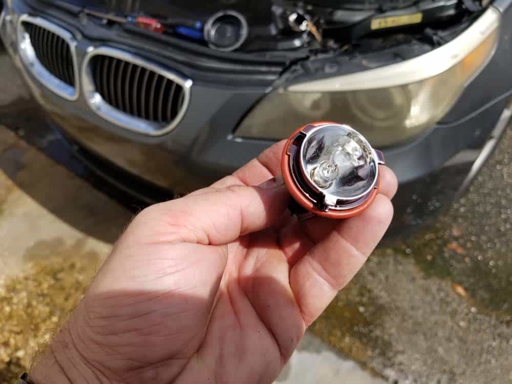 The BMW E60 parking lamp bulb removed from the vehicle