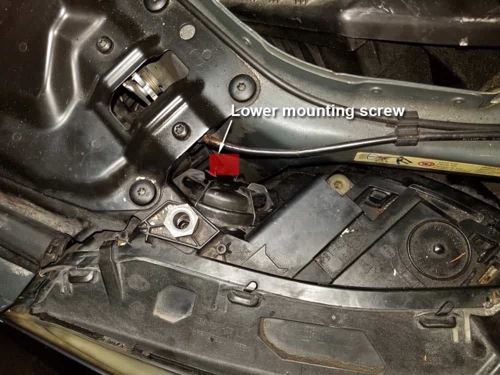 Locate the inside lower mounting screw