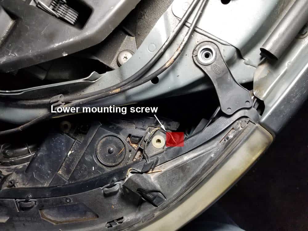Locate the outside lower mounting screw