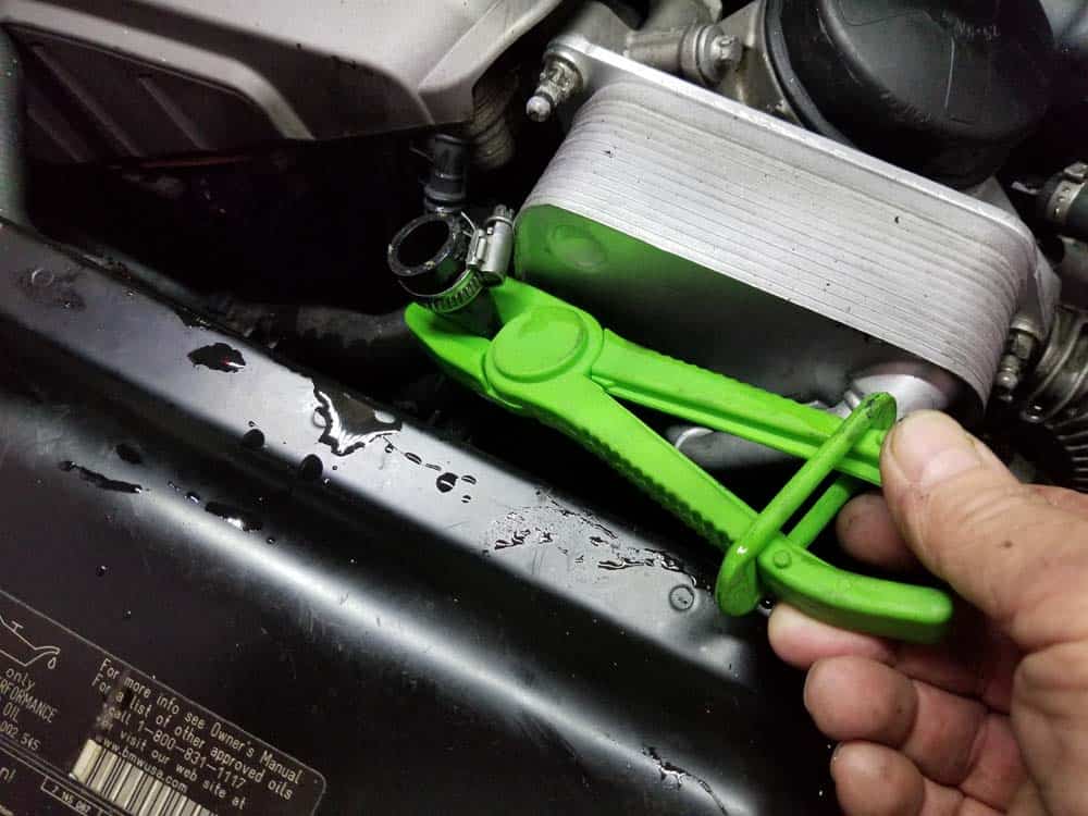 Use a pair of hose pinch off pliers to prevent coolant from leaking out