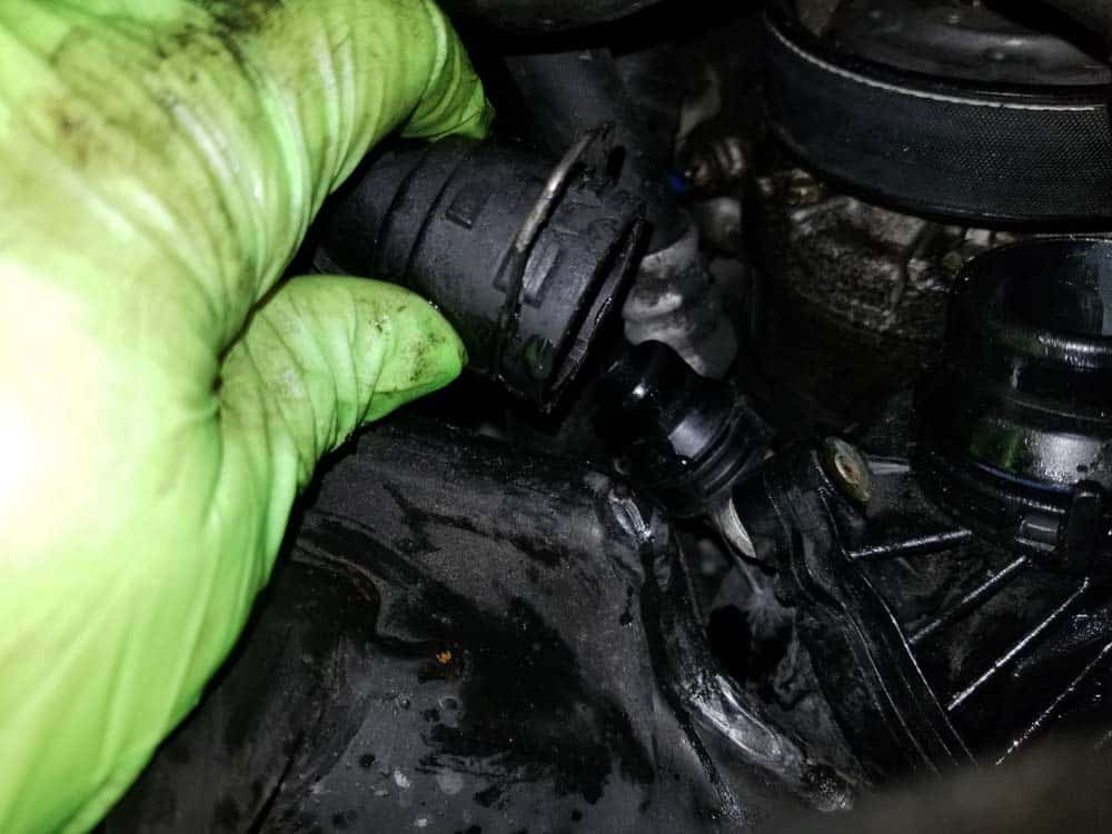 Remove the heater return hose from the thermostat