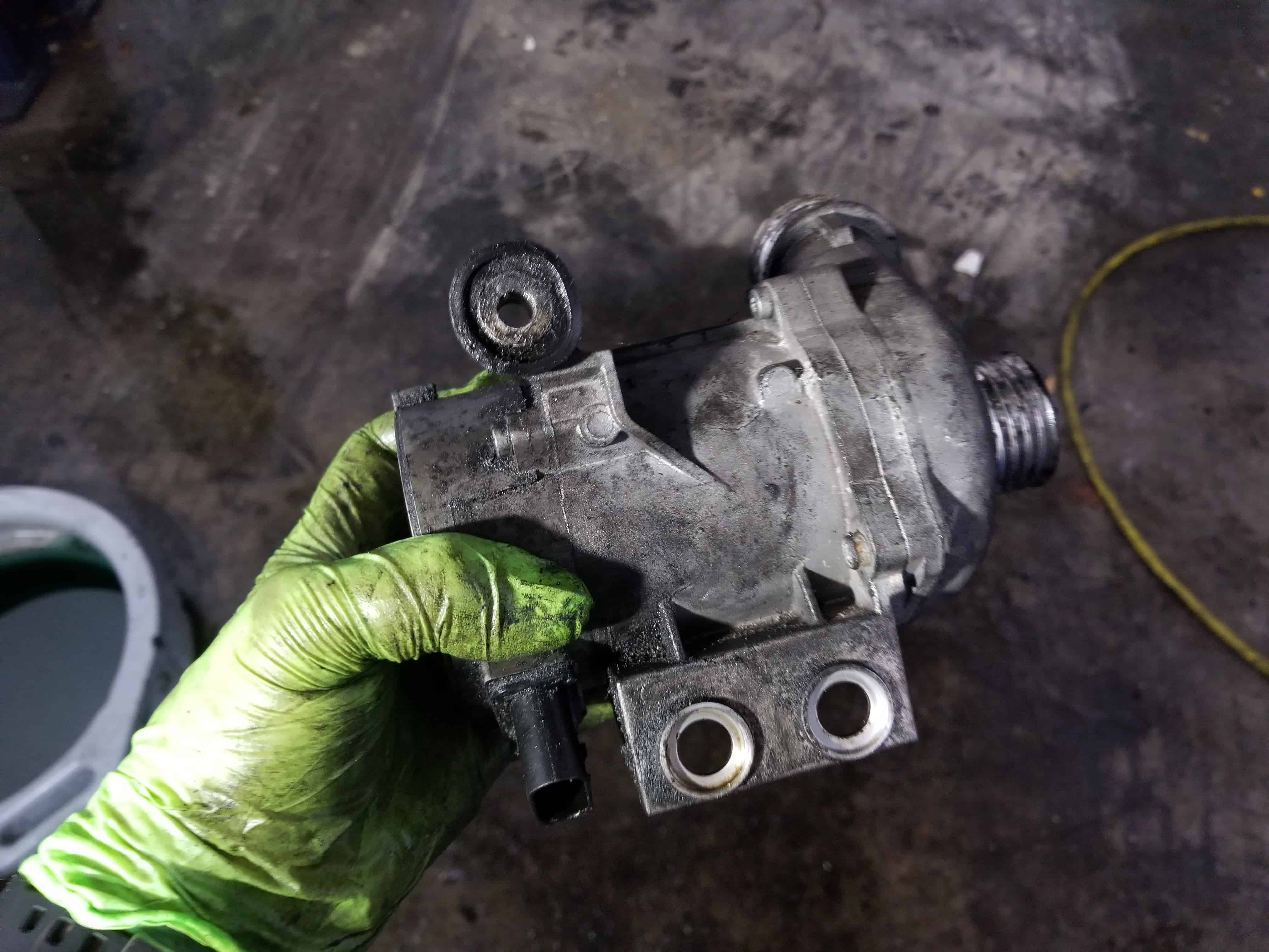 bmw e60 thermostat replacement - Remove the water pump from the vehicle