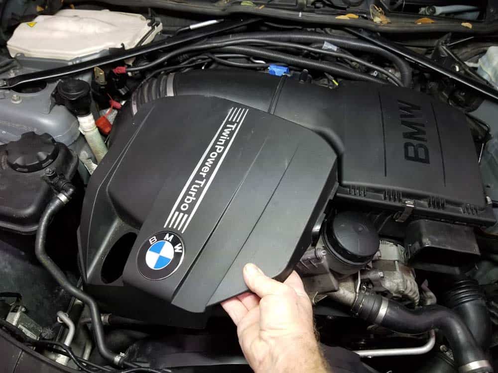 bmw n55 starter replacement - Remove the cover from the top of the engine.
