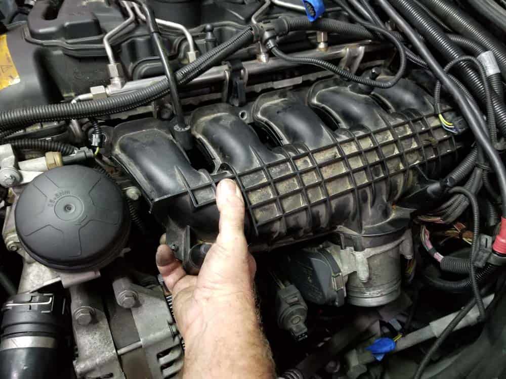 Carefully pull the intake manifold free of the cylinder head
