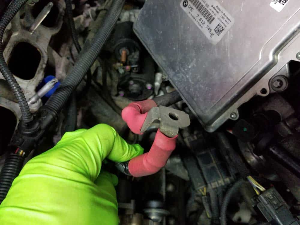 Remove the positive battery cable from the starter