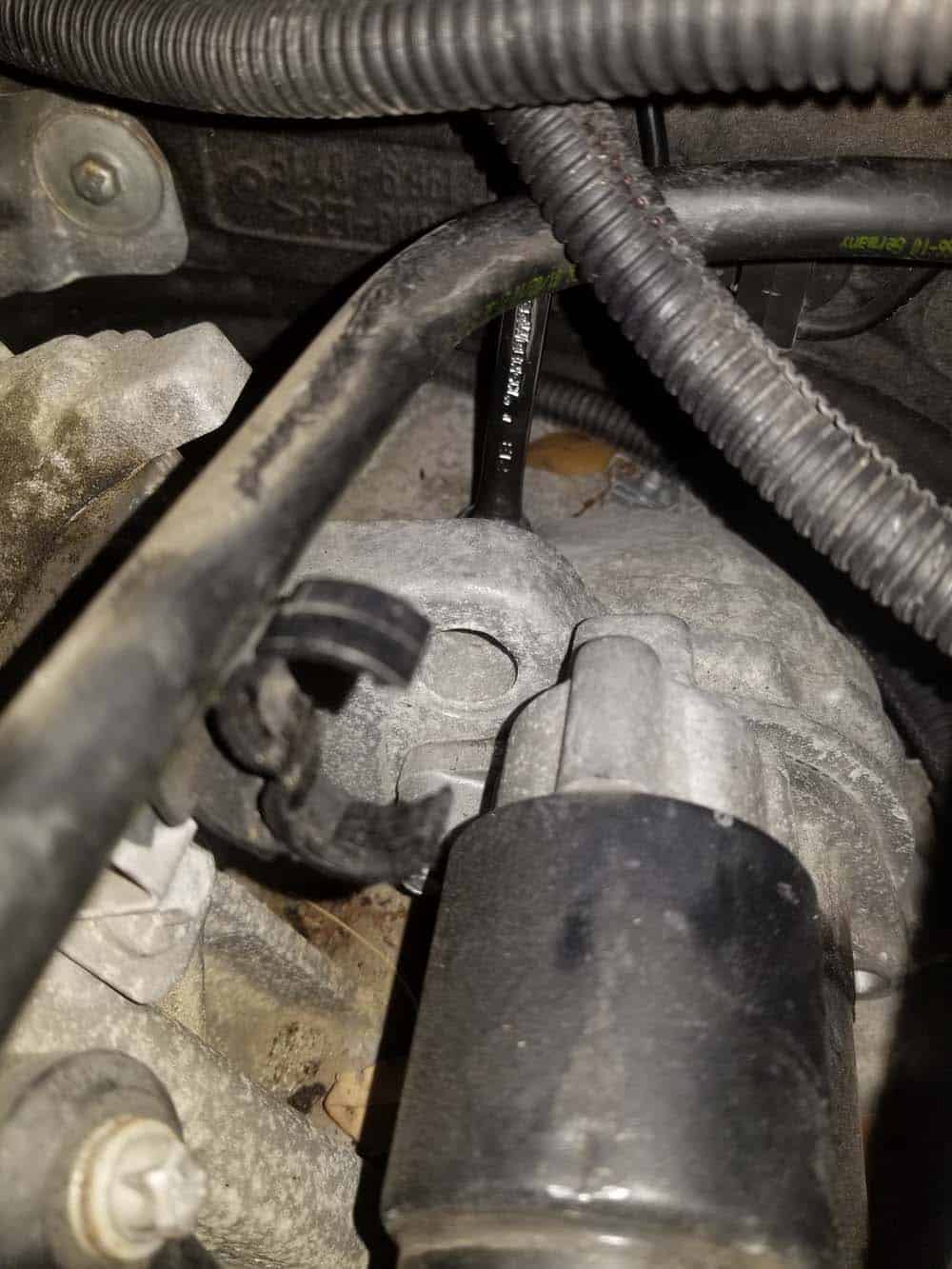 bmw n55 starter replacement - Use the ratcheting E12 wrench to remove the upper mounting bolt