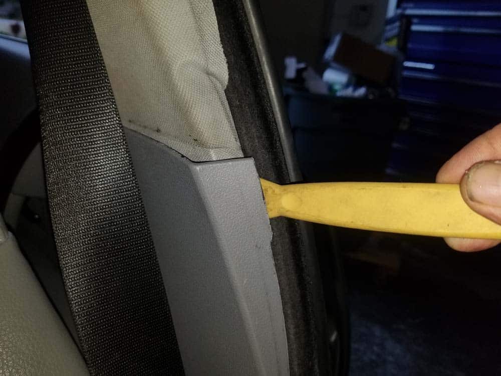 Pry the bottom of the B pillar trim away from the body of the vehicle