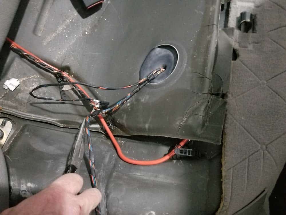 Unsnap any wiring harnesses around the fuel pump