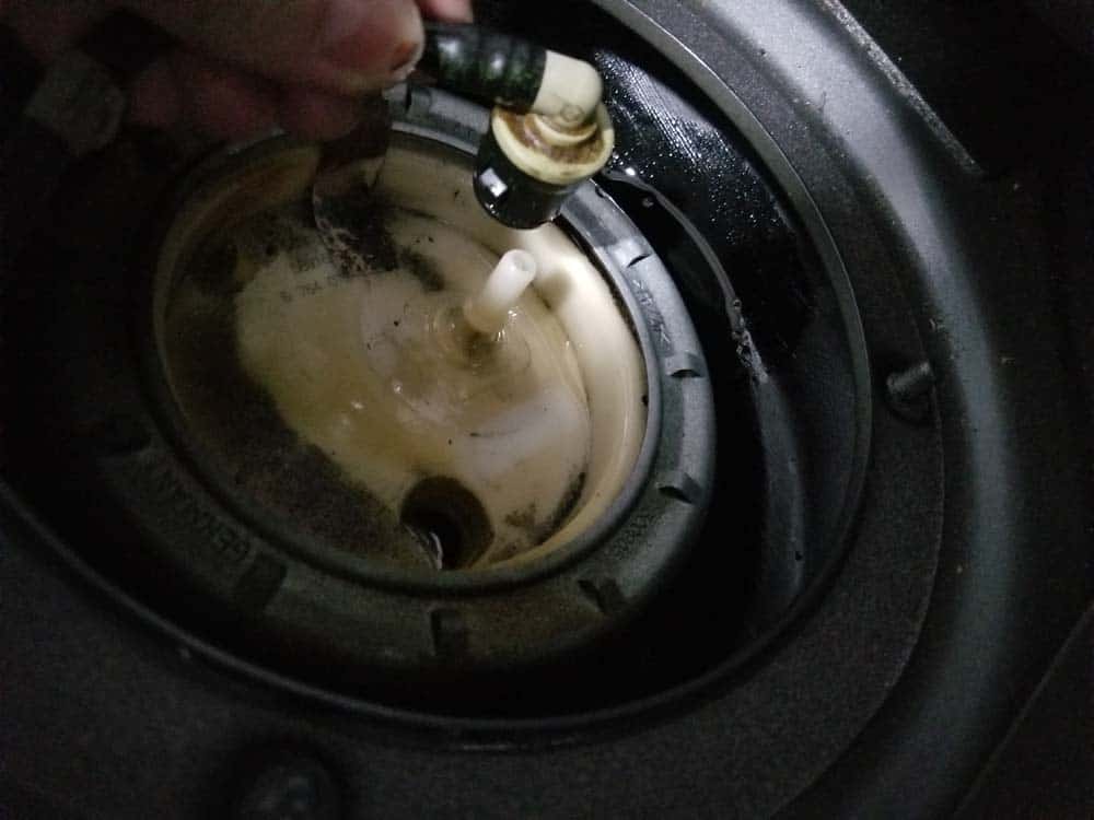 Remove the fuel feed line from the top of the fuel filter