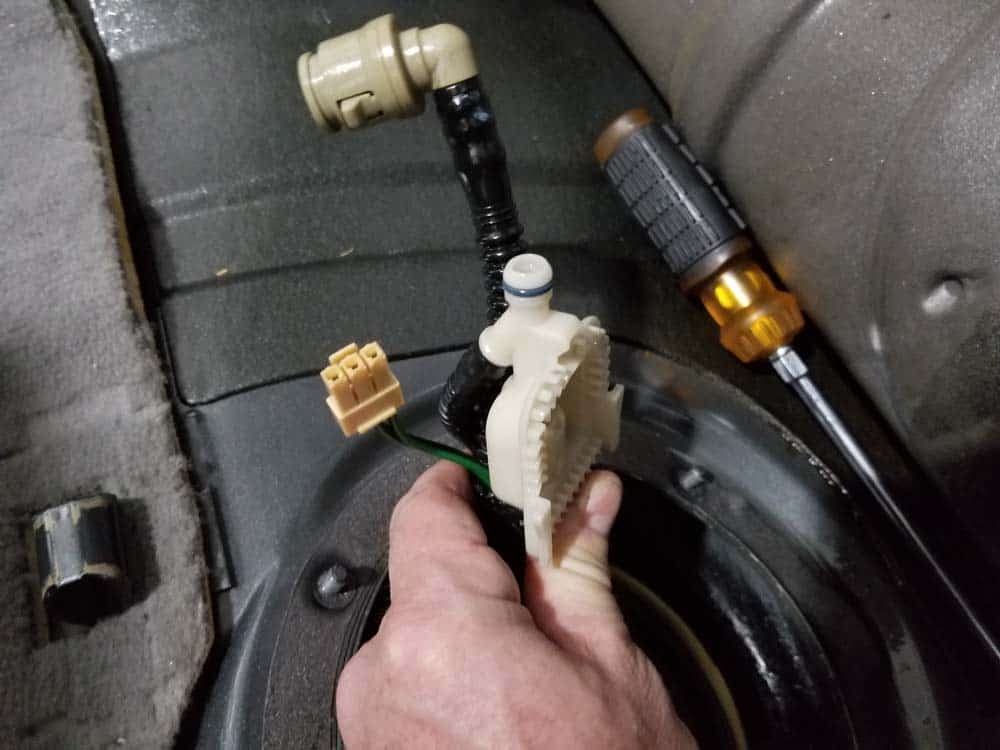 Completely disconnect the fuel filter and remove from the vehicle.
