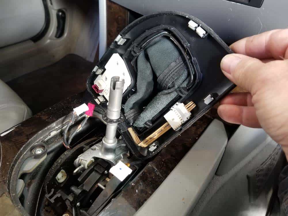 Unplug the back of the shifter trim.