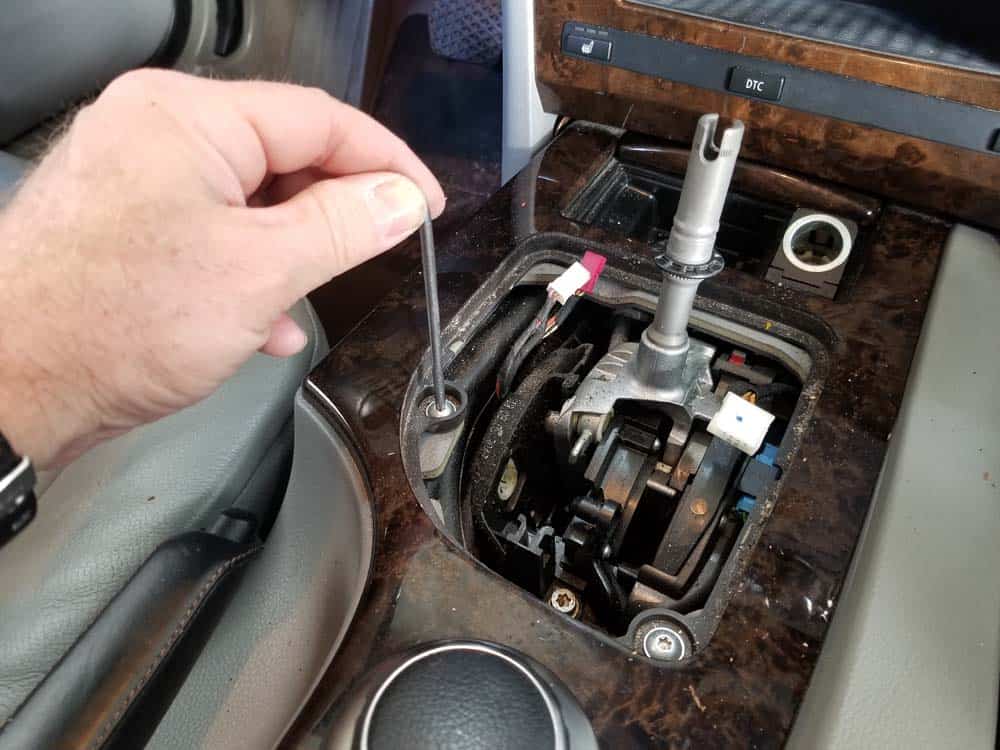 bmw e60 idrive upgrade - Remove the two center console trim screws