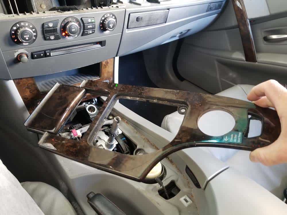 Remove the center console trim from vehicle.