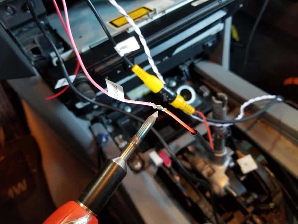 Solder the backup camera trigger wire to the display trigger wire and heat shrink the connection