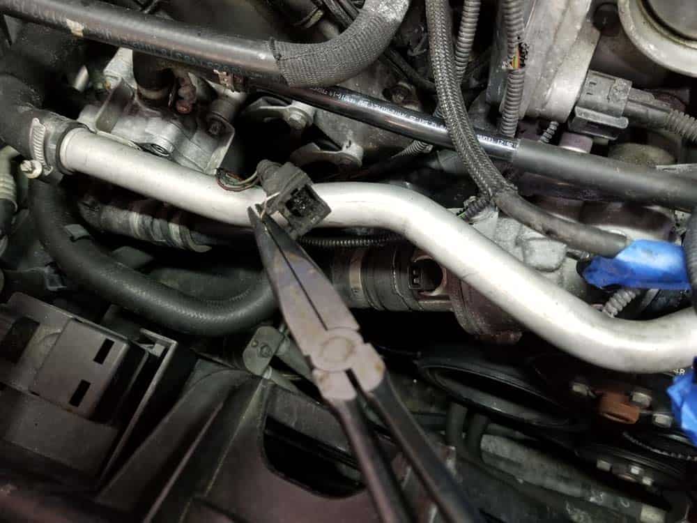 bmw n62 fuel injector replacement - A pair of long nose pliers helps in removing the plugs