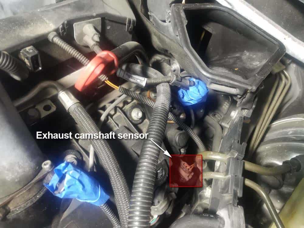 bmw n62 fuel injector replacement - locate the exhaust camshaft sensor on the left side of the engine