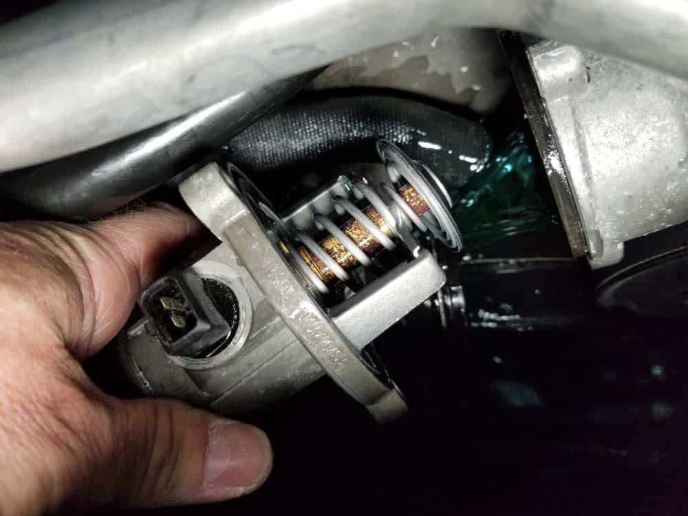 Pull the thermostat free from the water pump