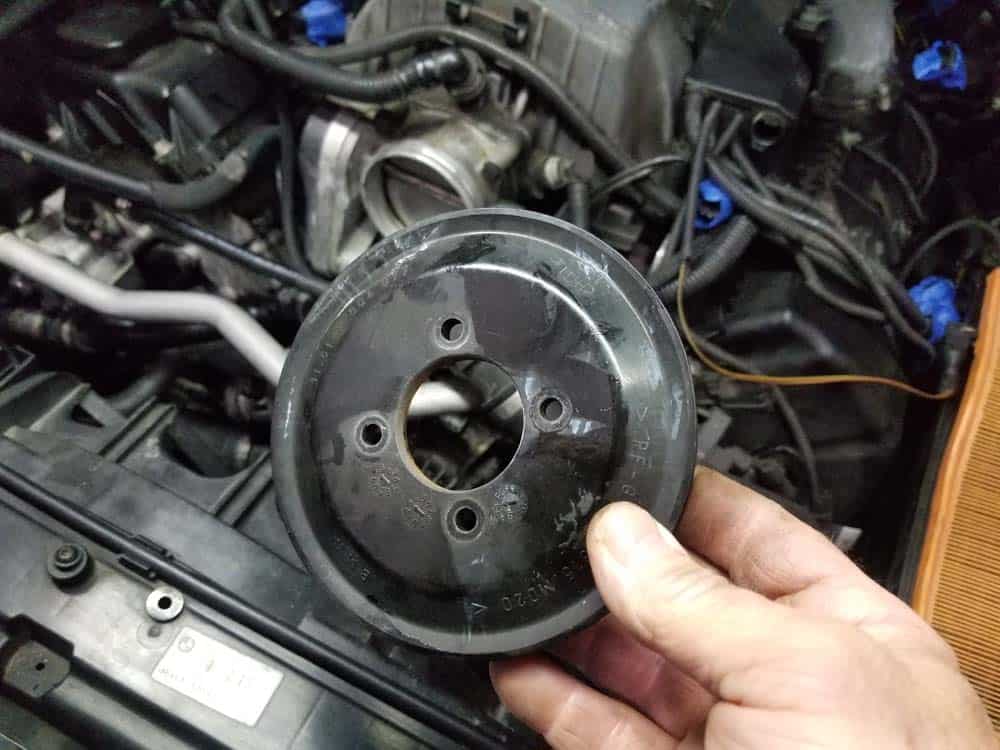 bmw water pump replacement - Remove the water pump pulley from the vehicle