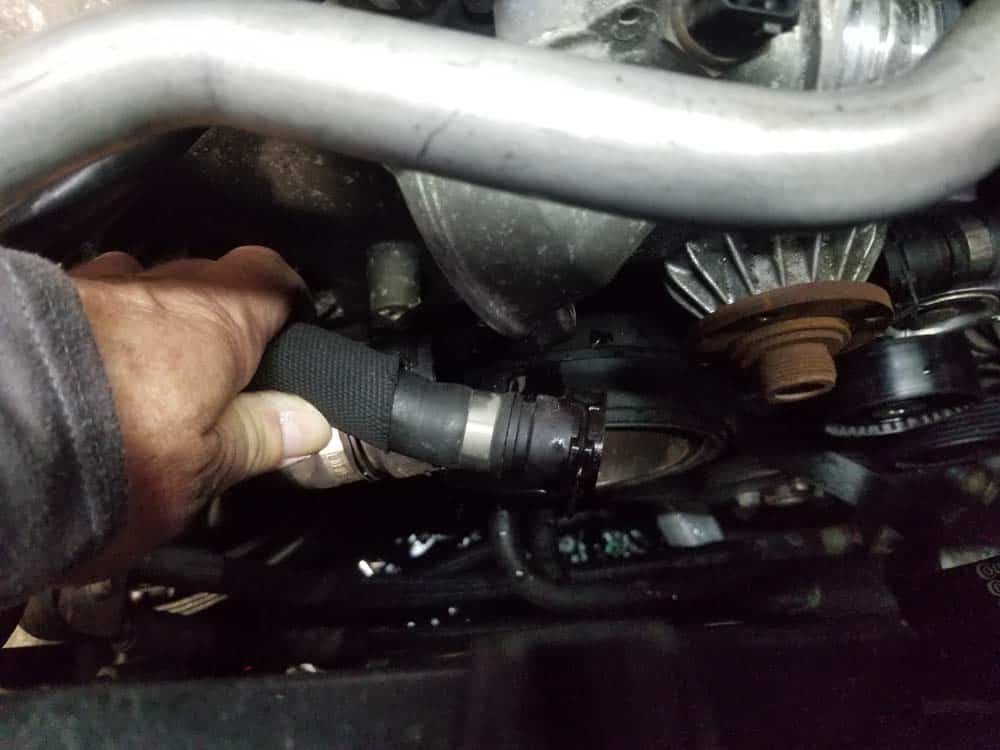 bmw n62 water pump replacement - Remove the expansion tank return hose from the water pump.