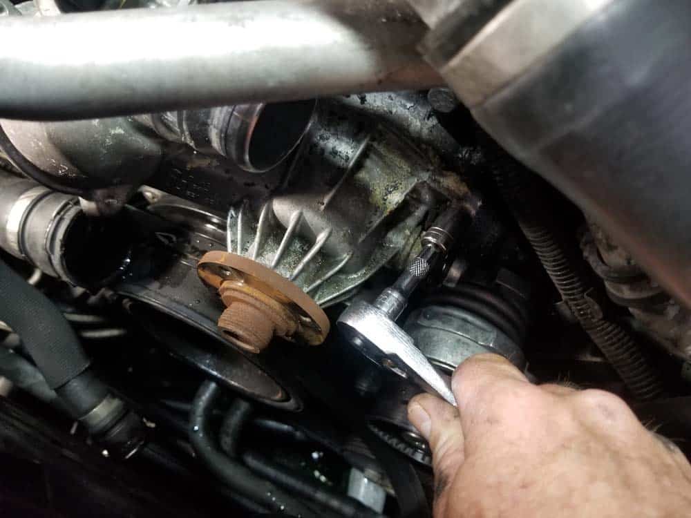 bmw water pump replacement - Remove the upper four mounting bolts from the water pump