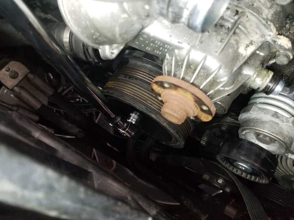 Use a T45 torx bit to remove the eight harmonic balancer pulley bolts