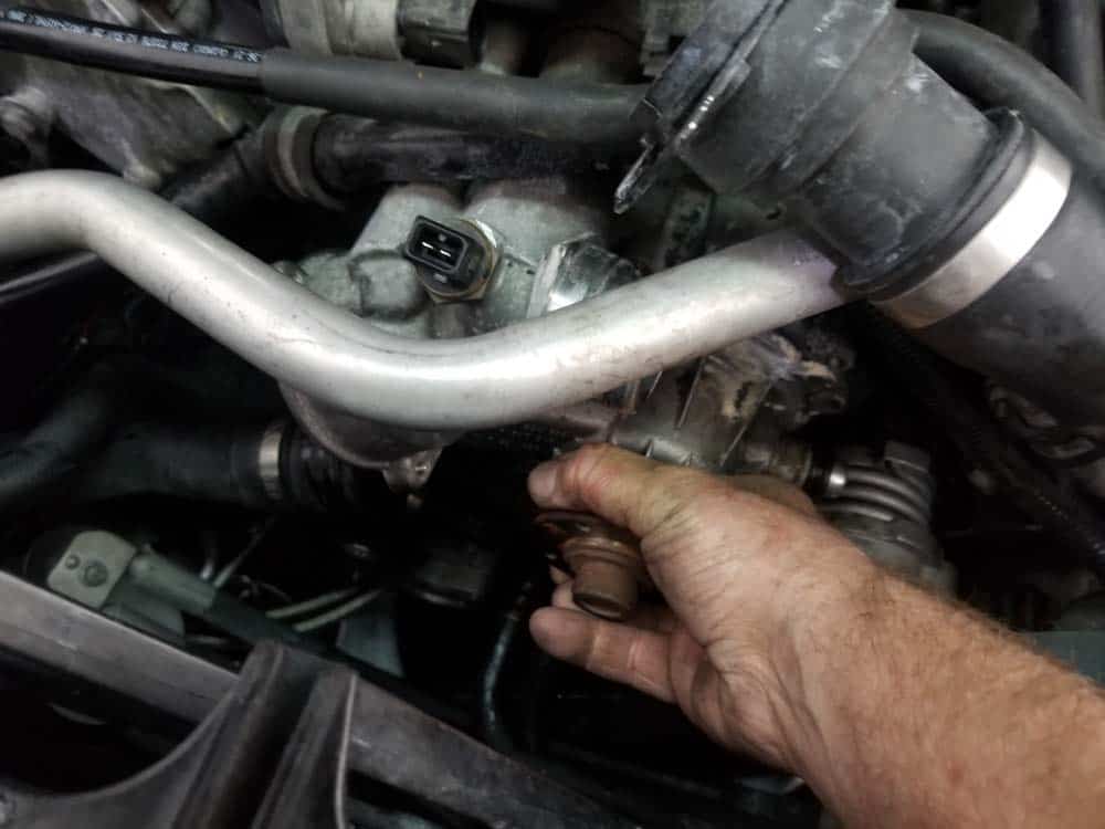 bmw water pump replacement - Grasp the water pump and pull it loose from the engine block