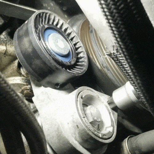 bmw water pump replacement - Turn the ac belt tensioner counterclockwise to release pressure on the belt