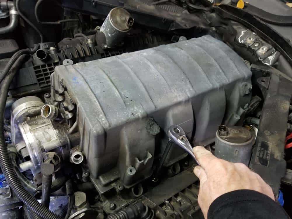 Remove the left intake manifold mounting nuts