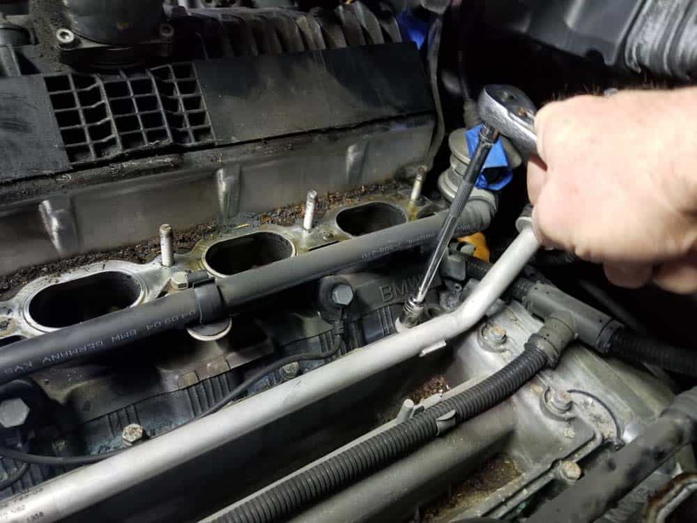 bmw n62 valley pan replacement - Remove the 10mm bolts anchoring the valley pan to the engine