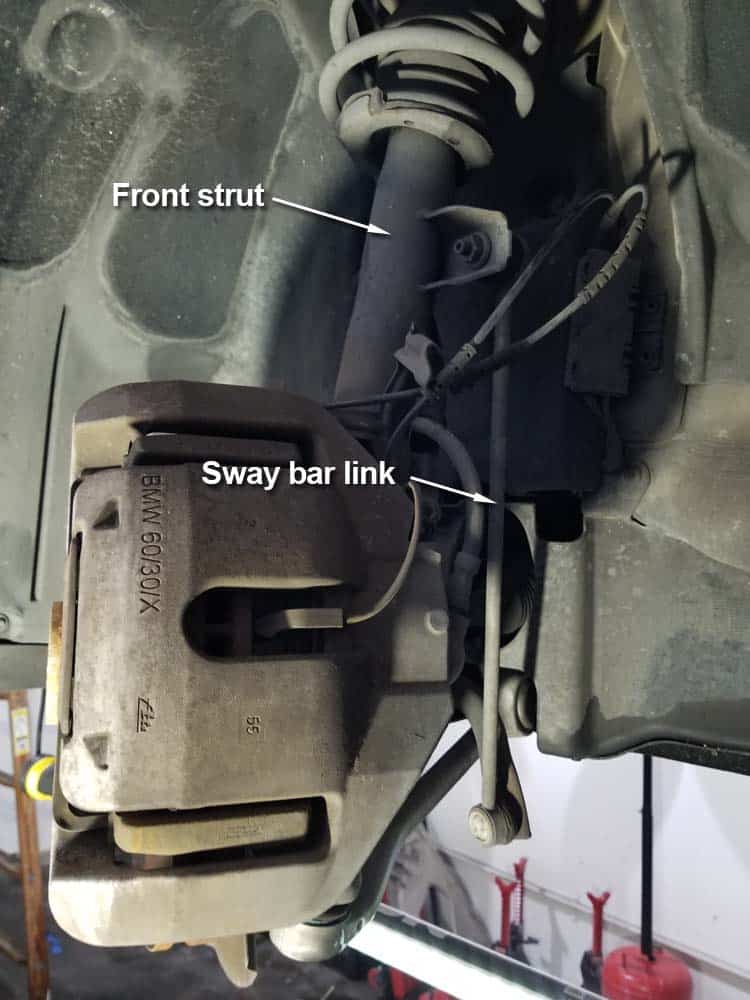 bmw e60 front strut replacement - Locate the sway bar link on the front strut