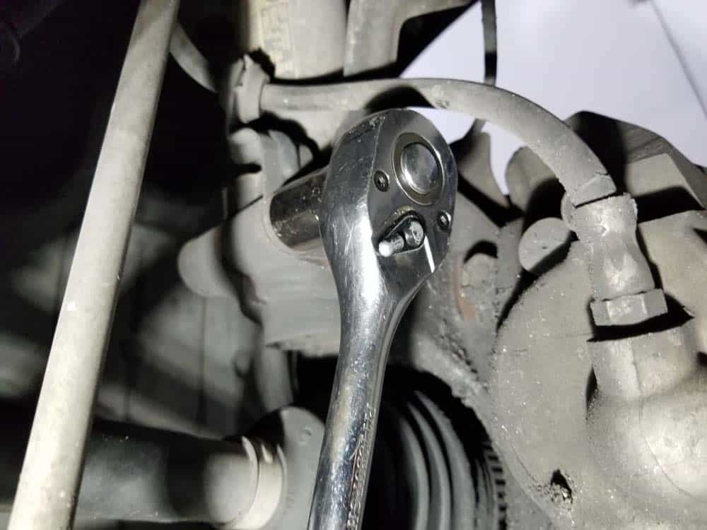 bmw e60 front strut replacement - Use an 18mm socket wrench to remove the steering knuckle bolt