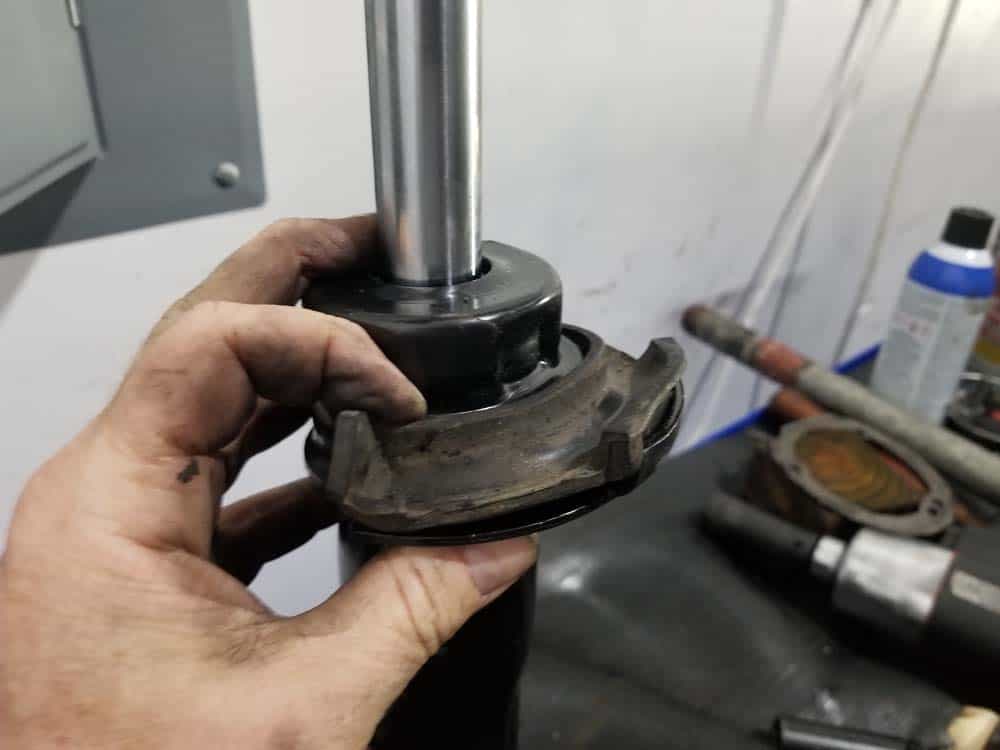 bmw e60 front strut replacement - installing the lower spring pad