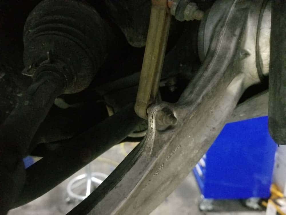 bmw e60 front strut replacement - Disconnect the headlight leveling sensor on the right control arm